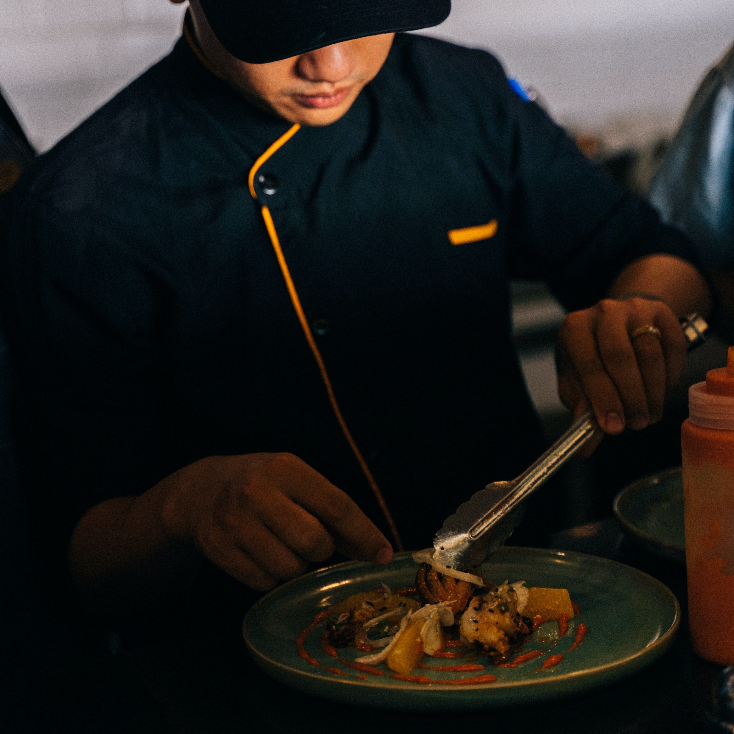 Man prepping a seafood platter.